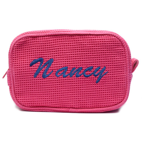 Trousse de maquillage tissage gaufré en coton fuchsia nom brodé